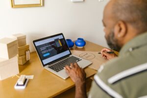 Middle aged man using Laptop.